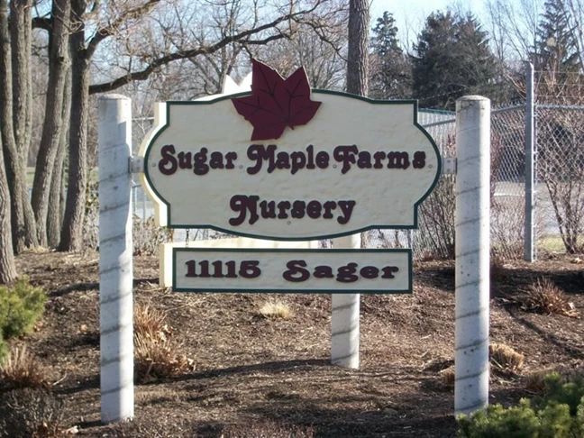 Sandblasted and painted sign, made out of high density foam, installed at a nursery near Toledo Express Airport.