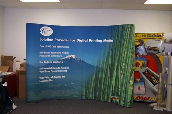 A combination including a magnetic popup display system and a retractable image banner stand