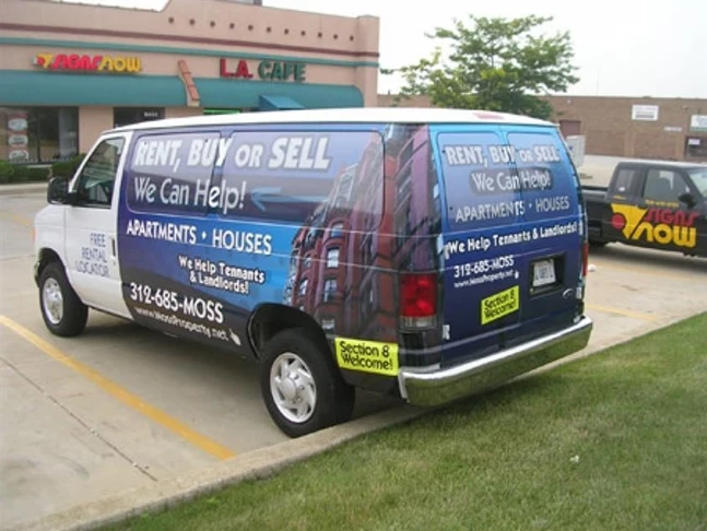 Digitally printed vinyl vehicle wrap and window graphics serve as mobile advertisement for Moss Property